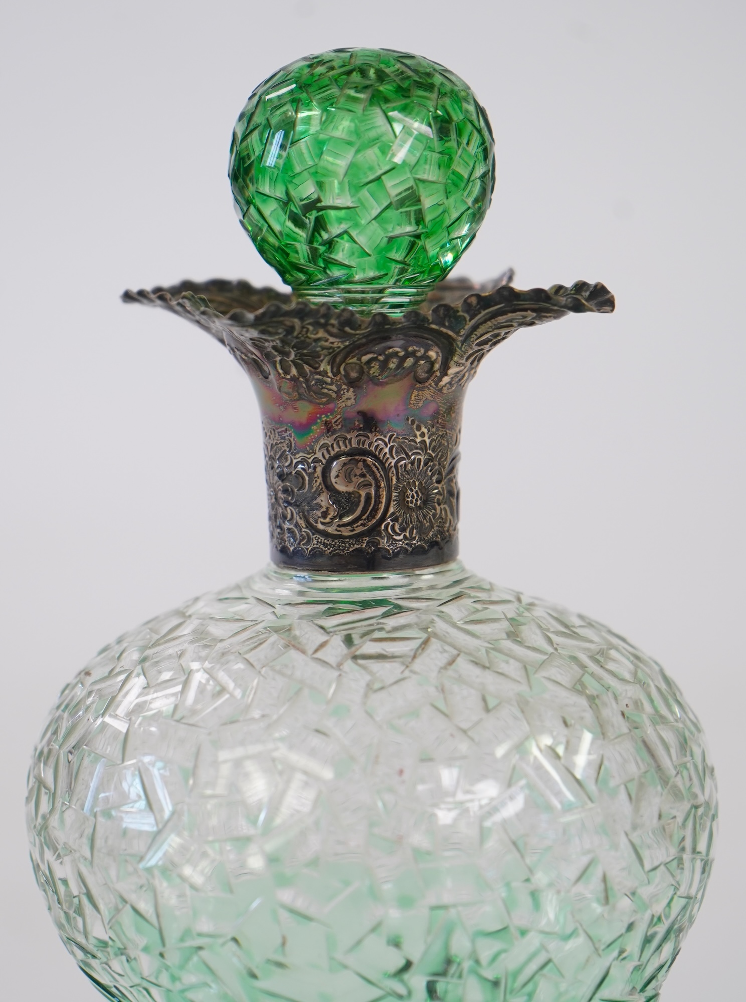 Attributed to Stevens and Williams of Stourbridge, a green flashed and cut pinched glass decanter